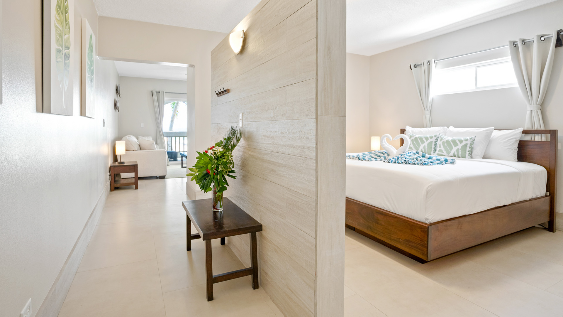 Suite bedroom with living area and ocean view